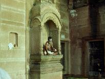 Holy man in a niche along the river